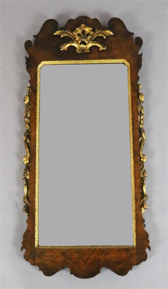 A George III figured walnut and giltwood wall mirror, W.1ft 10in. H.3ft 8in.
